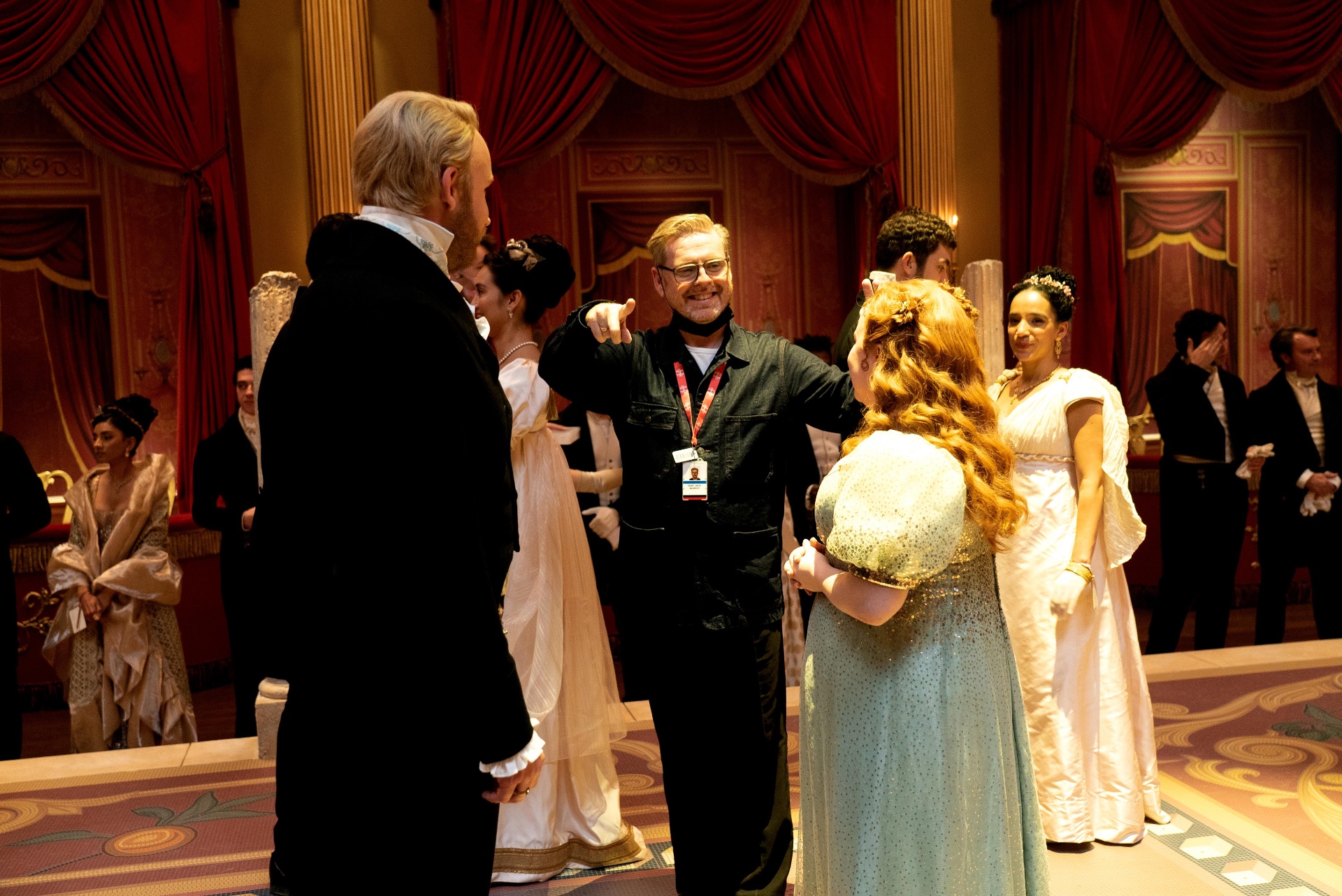Jack Murphy directing the cast during a Bridgerton ballroom scene
