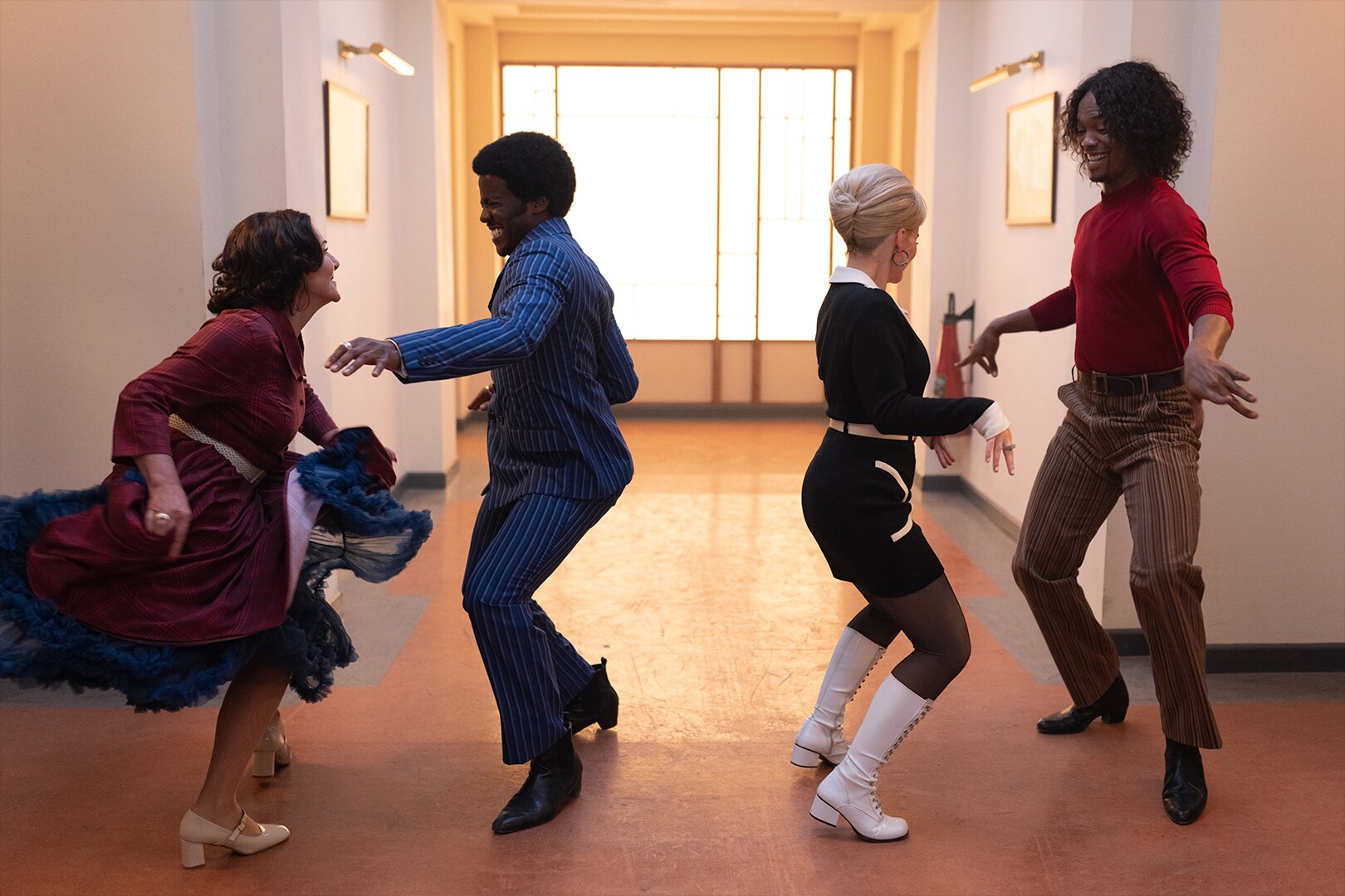 Doctor Who ballroom sequence with four dancers in a hallway