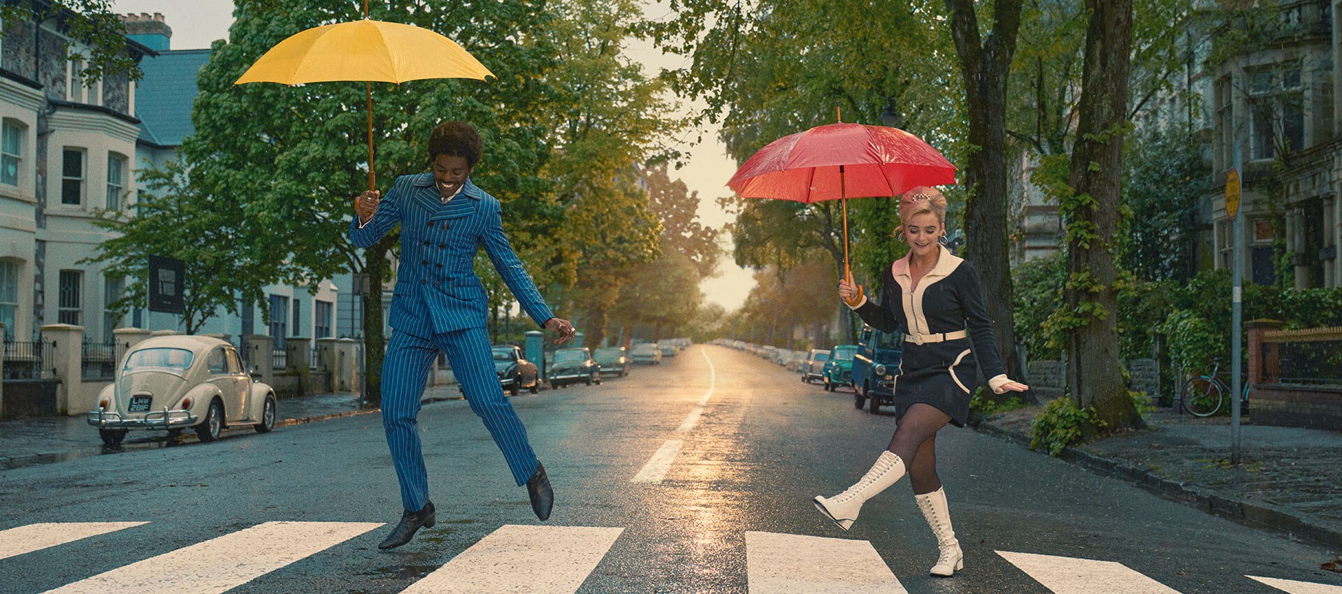 Doctor Who — The Devil's Chord, the Doctor and Ruby Sunday dancing with umbrellas on a Cardiff street