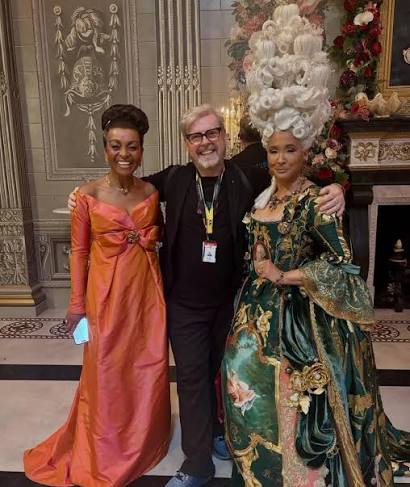 Jack Murphy with two Bridgerton cast members in ballroom costumes
