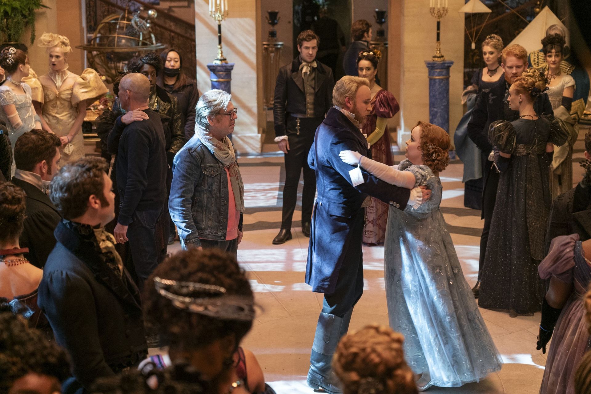 Jack Murphy directing a ballroom scene on the set of Queen Charlotte